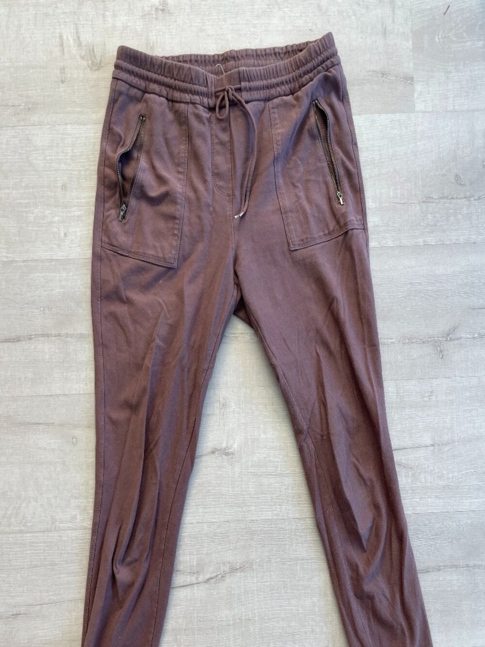Brown stretch waist joggers with zipper pockets
